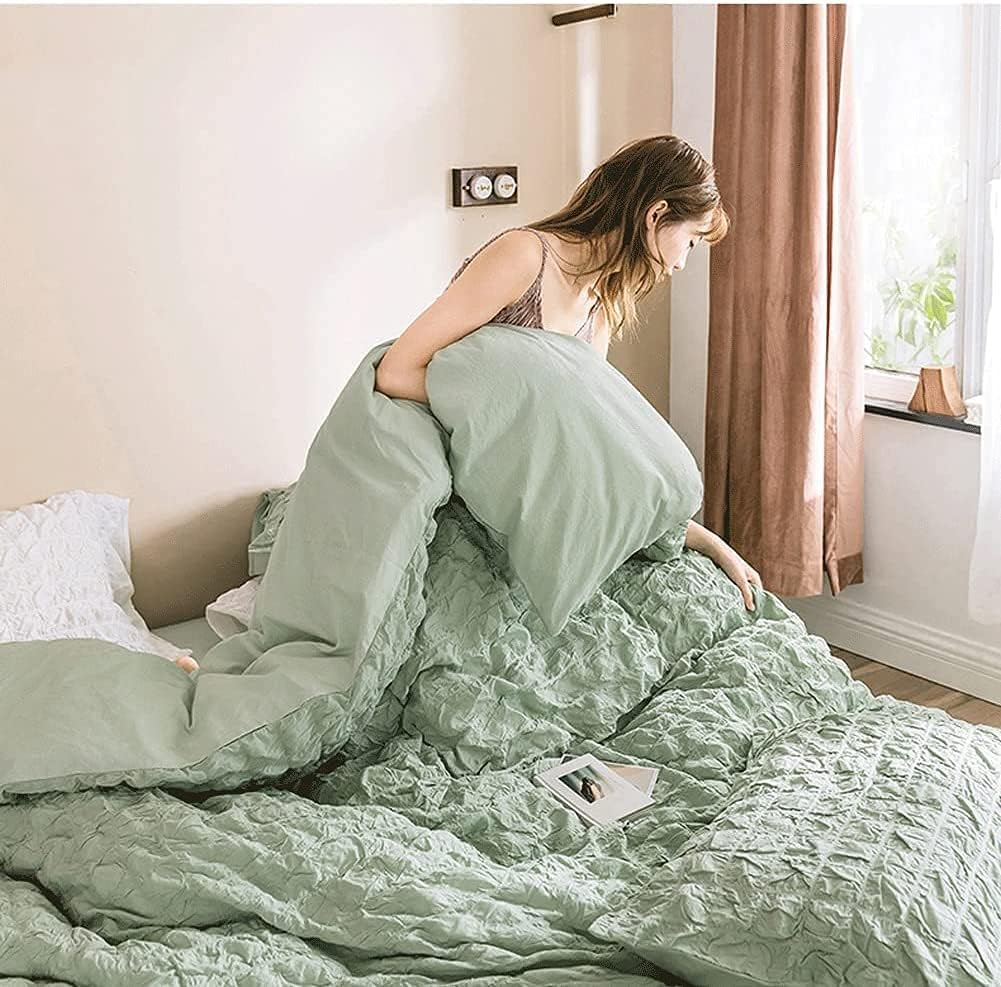 Bring a burst of fresh energy to your space with the VibeCore Aesthetic Tufted Duvet Cover Set in pastel green. Pictured with a girl holding the duvet cover in bed, this set radiates a cozy, inviting feel. The tufted texture and soft, calming pastel hues add a touch of elegance to your room, creating the perfect blend of style and comfort. Whether for a dorm or bedroom, it’s a dreamy addition that effortlessly enhances any space.
