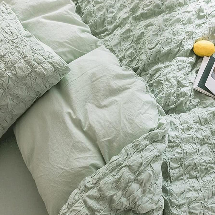 Experience the luxurious texture and comfort of the VibeCore Aesthetic Tufted Duvet Cover Set in pastel green. This close-up of the material showcases the plush, tufted design that not only feels incredibly soft against your skin but also adds a refined, cozy look to your space. Made with high-quality fabric, this duvet cover set offers a blend of sophistication and comfort, perfect for creating a peaceful, stylish retreat in your bedroom.