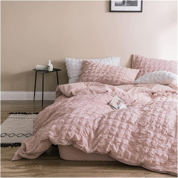 Elevate your space with the VibeCore Aesthetic Tufted Duvet Cover Set in rose. From the front left view, the delicate tufted details create a soft, inviting texture that adds elegance and warmth to your room. The muted rose tone enhances the cozy, sophisticated feel, making it a perfect addition to any modern bedroom.