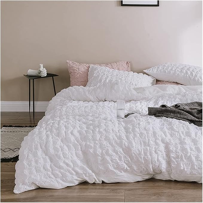 Elevate your space with the VibeCore Aesthetic Tufted Duvet Cover Set in white. From the front left view, the delicate tufted details create a soft, inviting texture that adds elegance and warmth to your room. The muted rose tone enhances the cozy, sophisticated feel, making it a perfect addition to any modern bedroom.