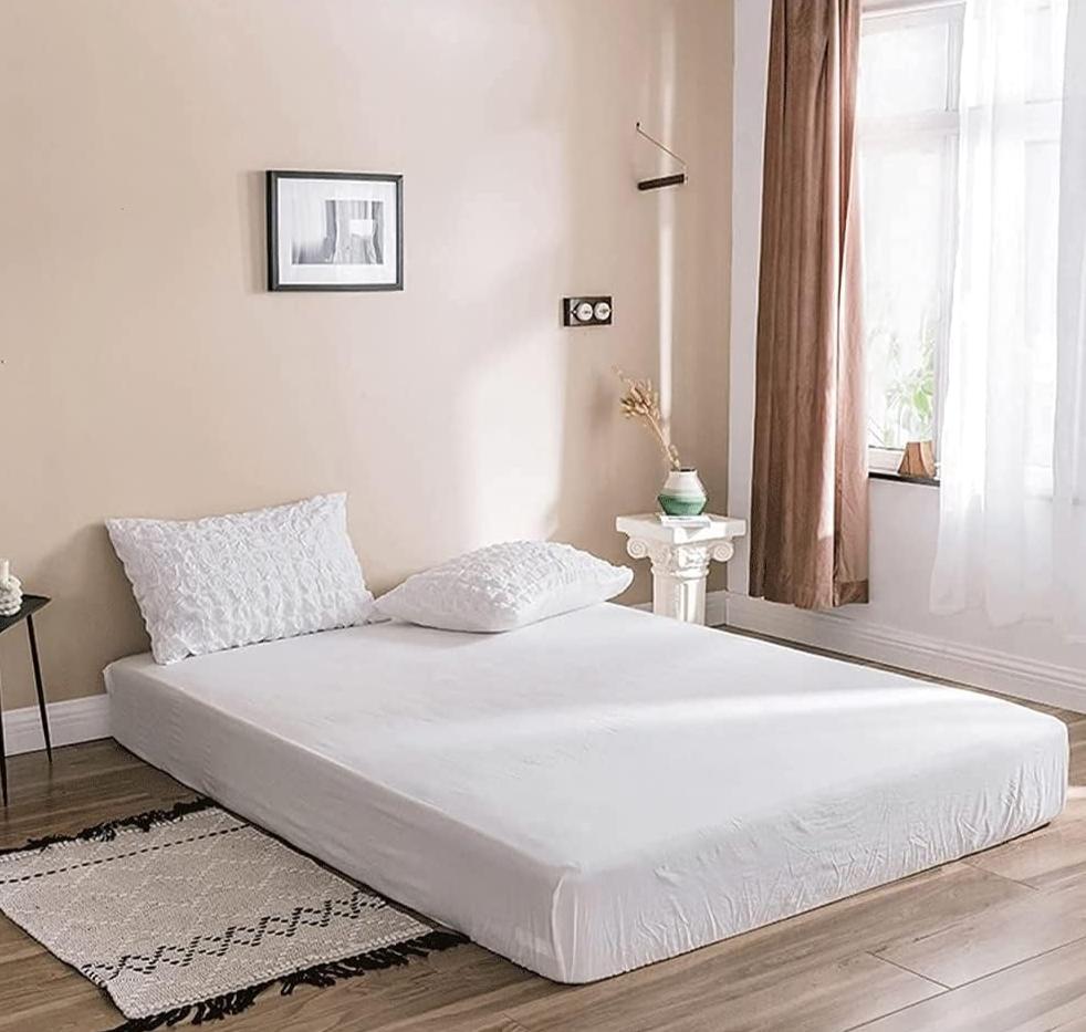 Transform your bedroom with the VibeCore Aesthetic Tufted Duvet Cover Set in white. Featuring a smooth, high-quality sheet, it complements the tufted duvet design for a clean and sophisticated aesthetic. Soft, breathable, and durable, this sheet ensures your space remains cozy and chic while offering effortless style that stands the test of time.
