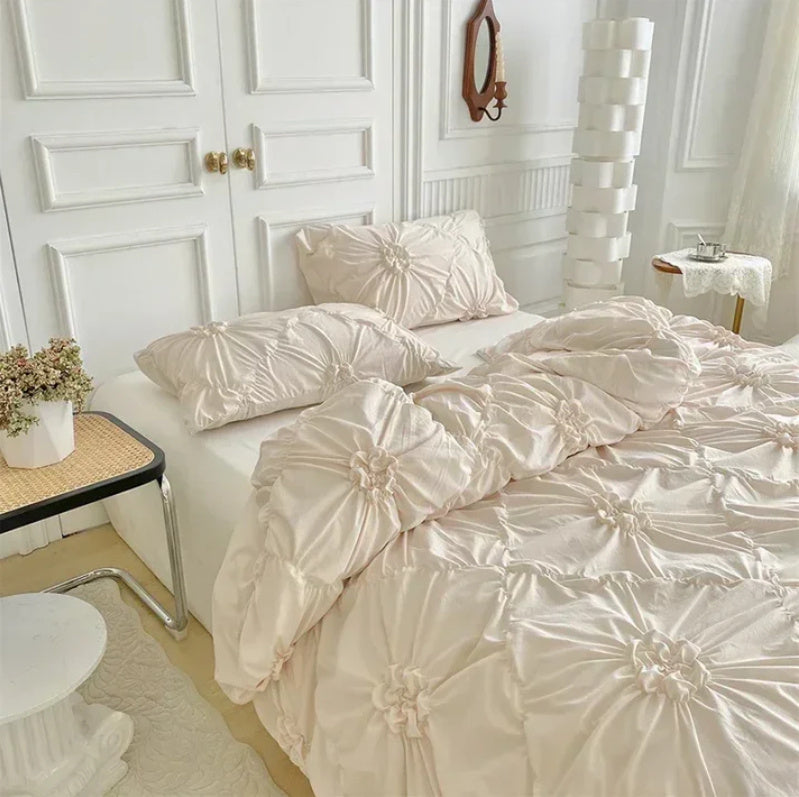 Close-up aerial view of the VibeCore Aesthetic Tufted Floral Pattern Duvet Cover Set in beige, highlighting the soft, textured floral pattern that creates a cozy and stylish atmosphere, perfect for adding a modern, aesthetic touch to your bedroom or dorm decor.