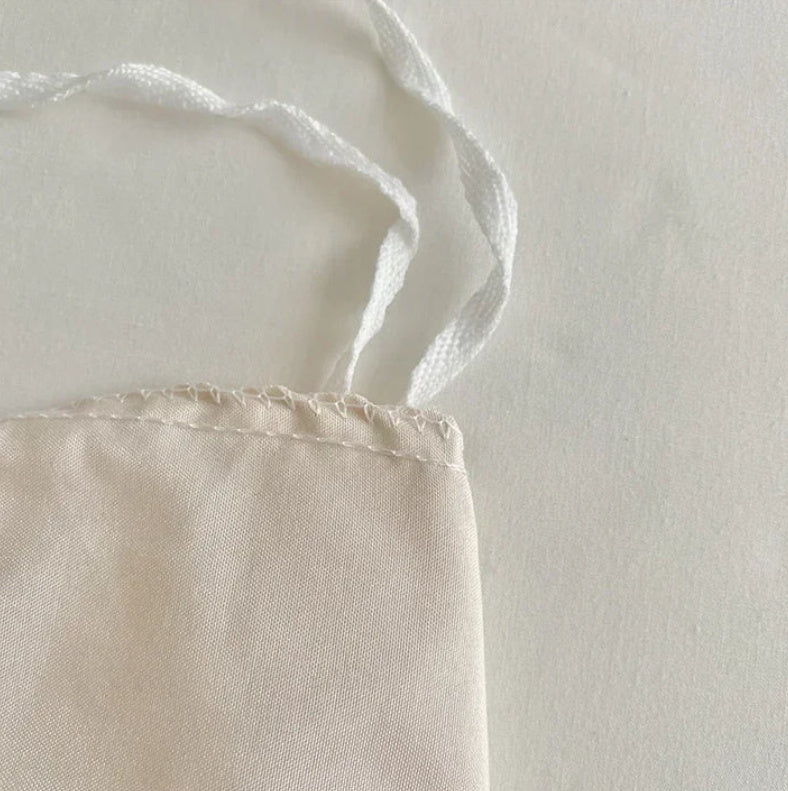 Detailed close-up of the stitching on the VibeCore Aesthetic Tufted Floral Pattern Duvet Cover Set in beige, highlighting the high-quality craftsmanship and delicate stitching that enhances the textured, tufted floral design for a refined and cozy finish.
