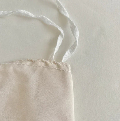 Detailed close-up of the stitching on the VibeCore Aesthetic Tufted Floral Pattern Duvet Cover Set in beige, highlighting the high-quality craftsmanship and delicate stitching that enhances the textured, tufted floral design for a refined and cozy finish.
