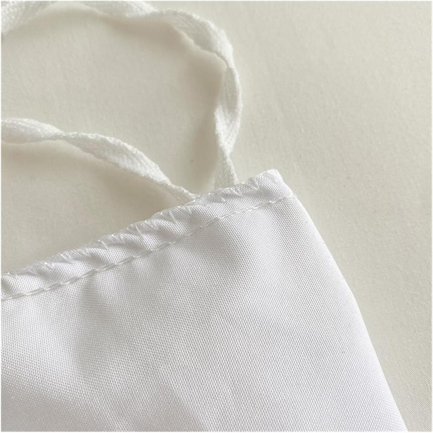 Detailed close-up of the stitching on the VibeCore Aesthetic Tufted Floral Pattern Duvet Cover Set in white, highlighting the high-quality craftsmanship and delicate stitching that enhances the textured, tufted floral design for a refined and cozy finish.