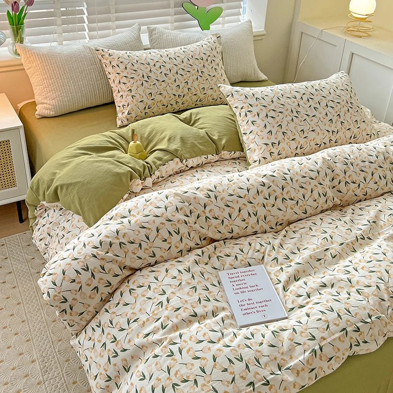 Left aerial view of the VibeCore Aesthetic Tulip Meadow Duvet Cover Set, highlighting the delicate tulip design in soft, vibrant colors. Crafted from breathable, cozy fabric, this set adds a fresh, floral charm to any bedroom or dorm.