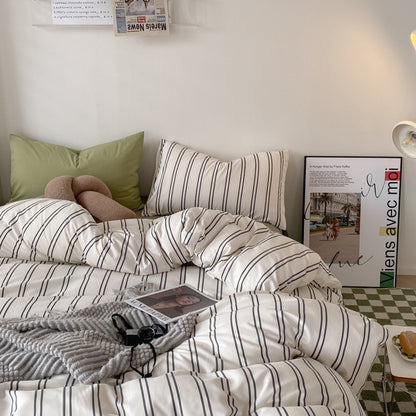 Aerial close-up of the black and white stripe pattern on the 'VibeCore Urban Stripe Bedding Set,' highlighting the clean, modern lines and soft, textured fabric. This minimalist design creates a chic and stylish look, adding a sleek touch to any bedroom or dorm.