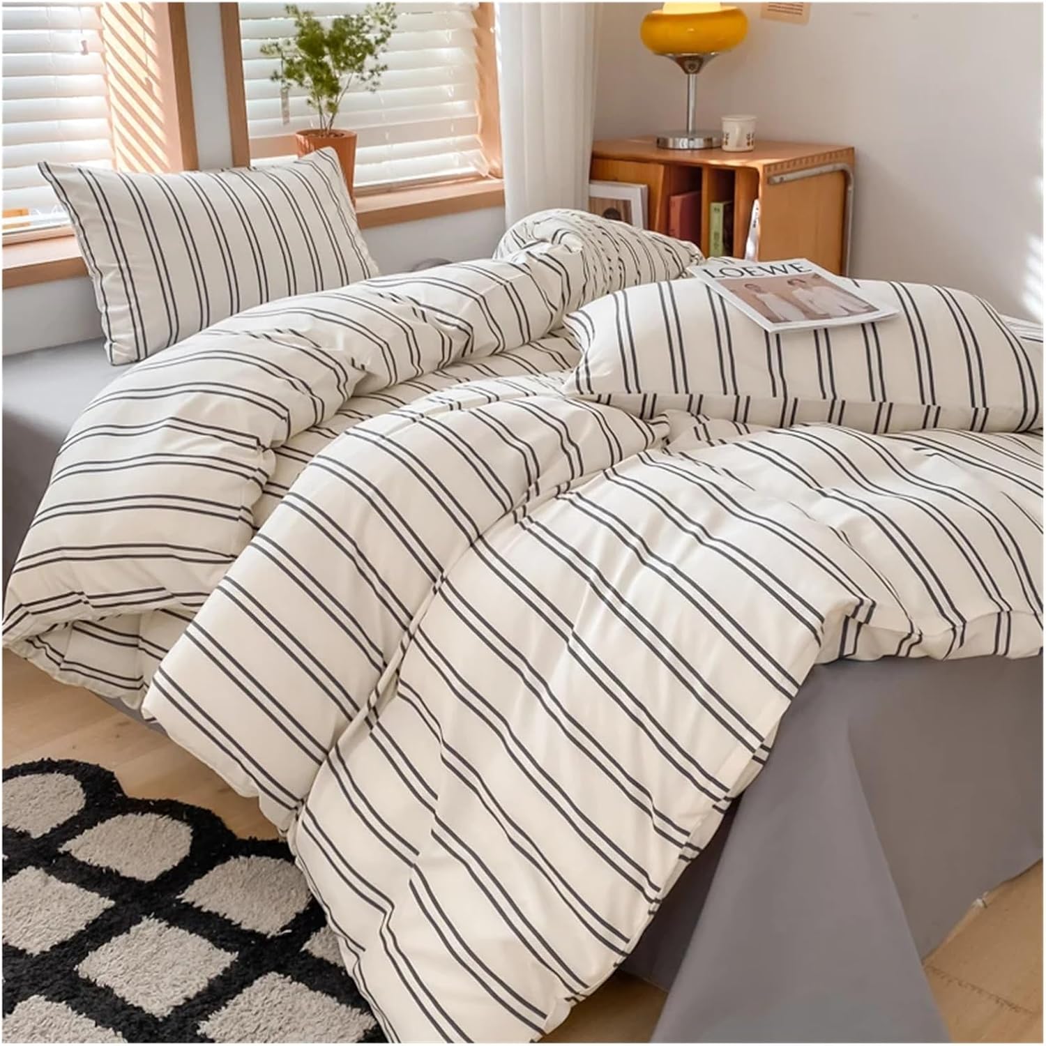 Aerial side view of the 'Urban Stripe Bedding Set,' featuring a sleek black and white stripe pattern on a soft cotton-polyester blend fabric. The modern, minimalist design adds a chic, comfortable touch to any bedroom, perfect for creating a cozy and modern atmosphere.