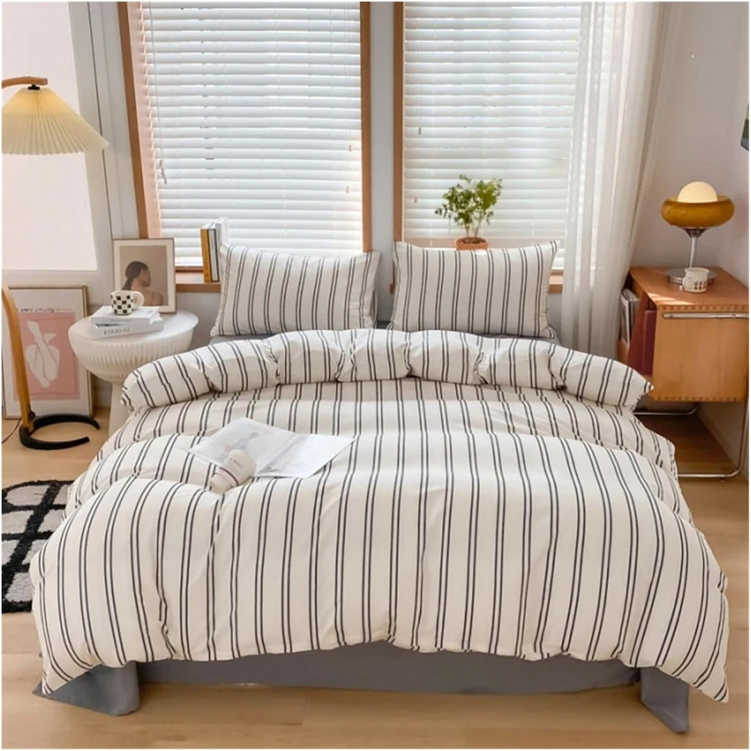Aerial view of the 'VibeCore Urban Stripe Bedding Set,' featuring a sleek black and white stripe pattern on soft, durable fabric. The minimalist design creates a modern, chic look, perfect for adding comfort and style to any bedroom or dorm.