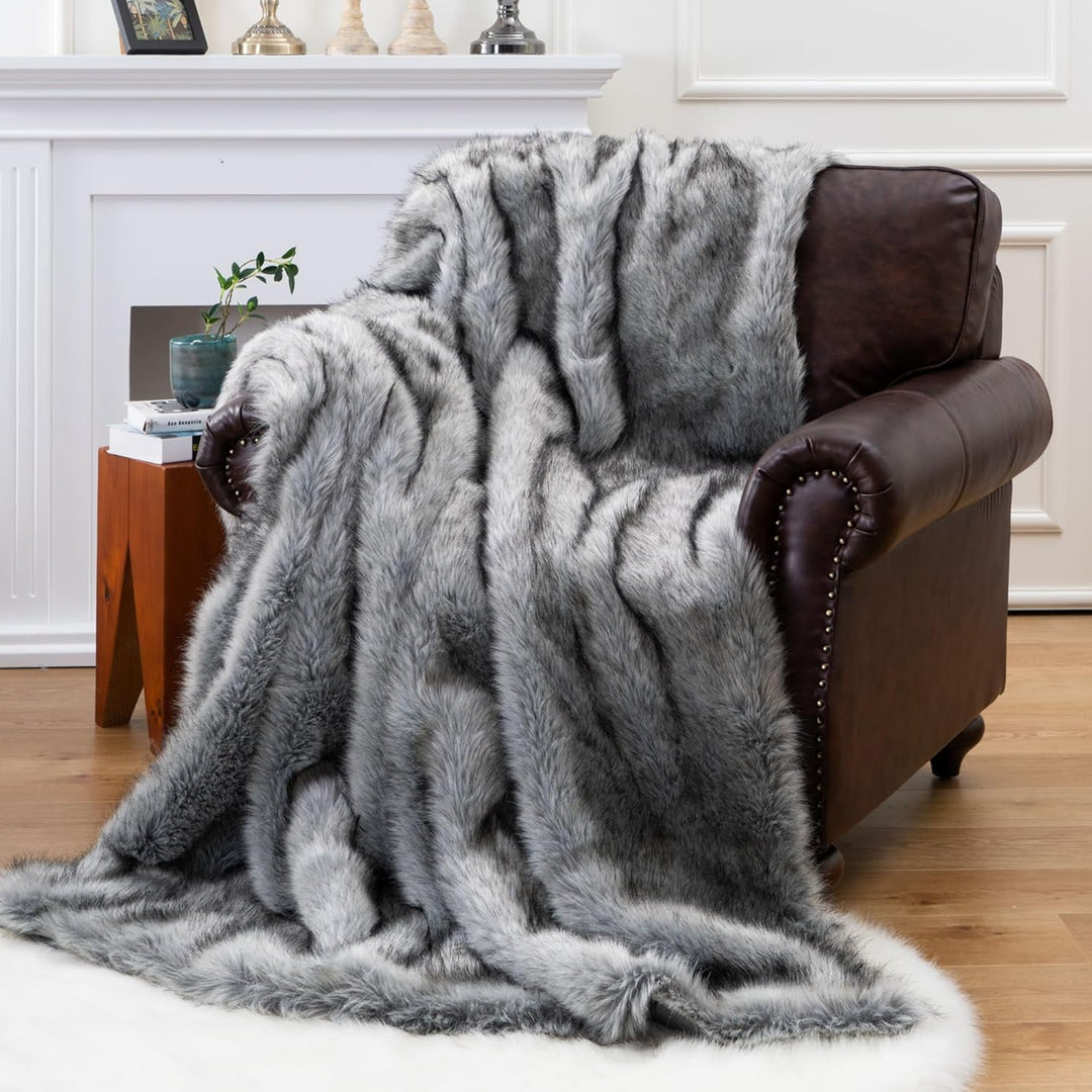 Gray Arctic Dream Faux Fur Throw Blanket draped over a chair, adding a luxurious, European-inspired touch. Soft, plush, and perfect for creating a cozy, elegant atmosphere in any room.