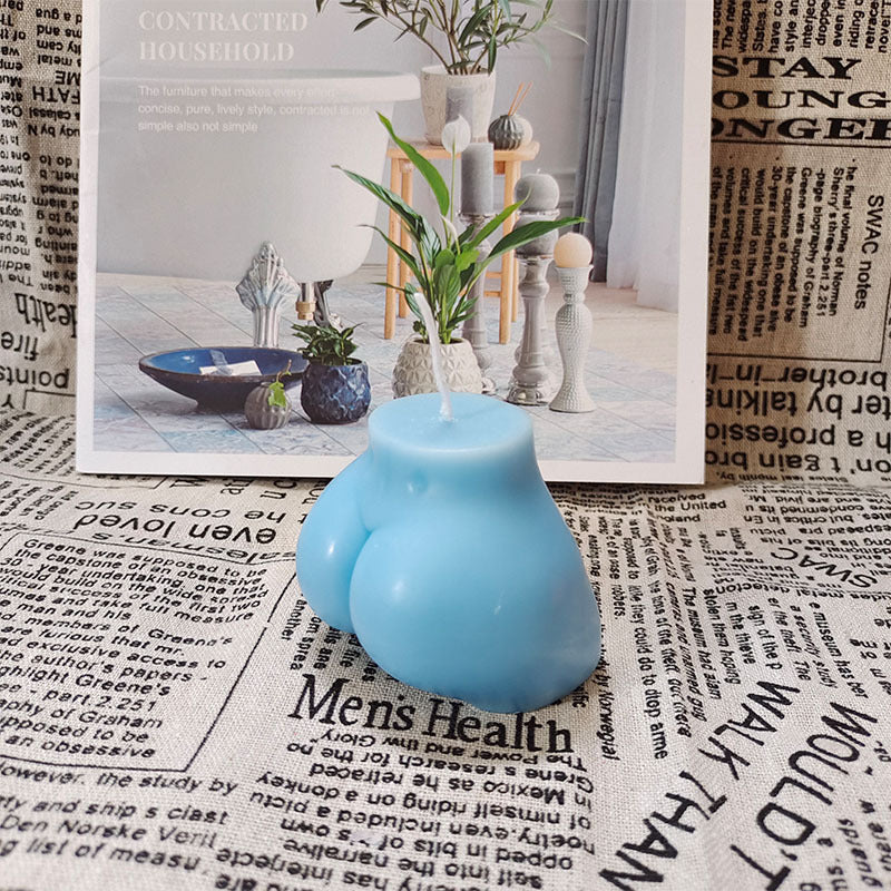 Crafted from premium soybean wax, this playful candle features a curvaceous bottom shape in a vibrant blue hue, adding a quirky touch to any room with its fun design and aromatic bliss.