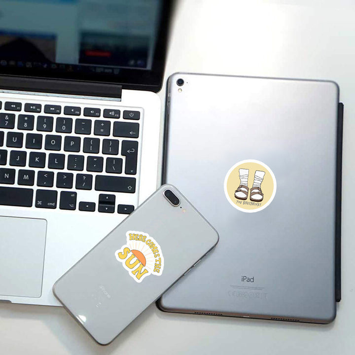 VibeCore Bright Yellow Stickers on phone and iPad, featuring vibrant designs, trendy phrases, and cute drawings. Perfect for adding personality to your devices.