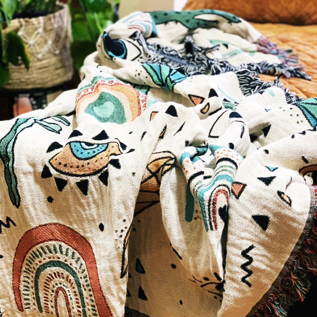 Close-up of the VibeCore Cactus & Crystals Woven Blanket, highlighting its soft, breathable cotton texture and vibrant cactus and crystal design.