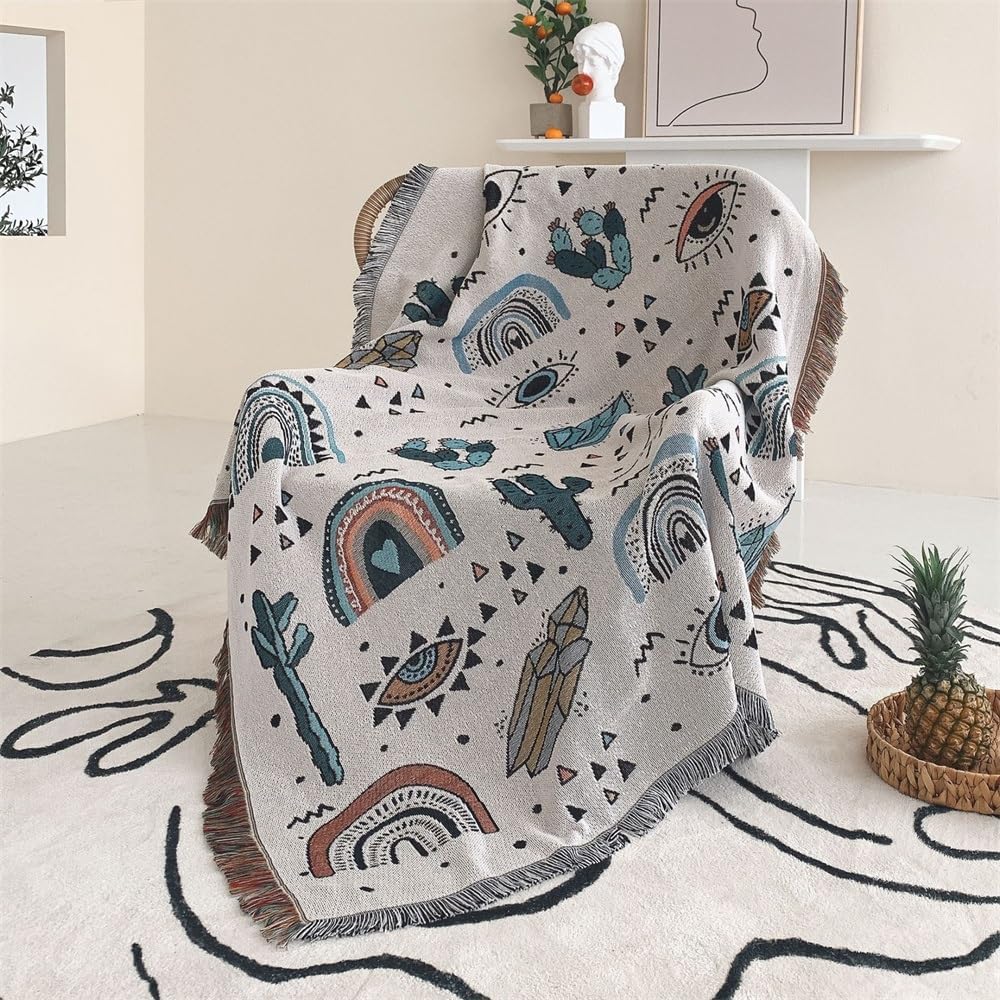 VibeCore Cactus & Crystals Woven Blanket draped over a chair, showcasing its earthy cactus and crystal design with soft, reversible cotton texture for a cozy, aesthetic touch.