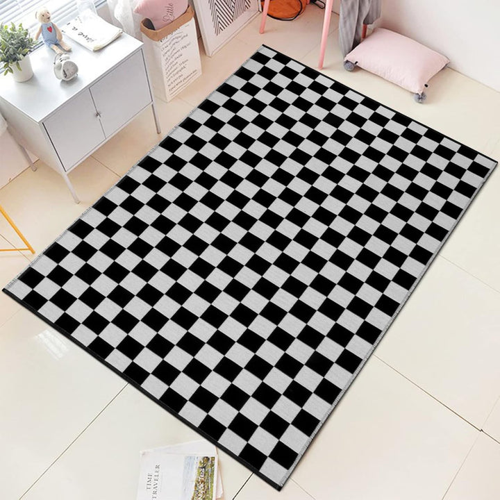 VibeCore Checkerboard Area Rug in Black on tile floor, showcasing a bold black and white checkerboard pattern, adding a modern and sleek look to the room.