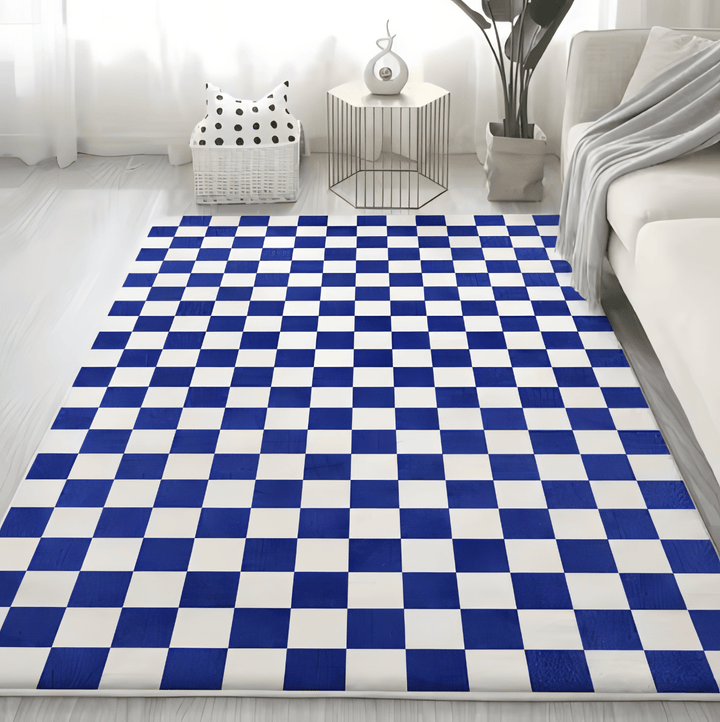 VibeCore Checkerboard Area Rug in Navy Blue placed in a modern living room, featuring a bold navy blue and white checkerboard pattern, enhancing the contemporary aesthetic of the space.