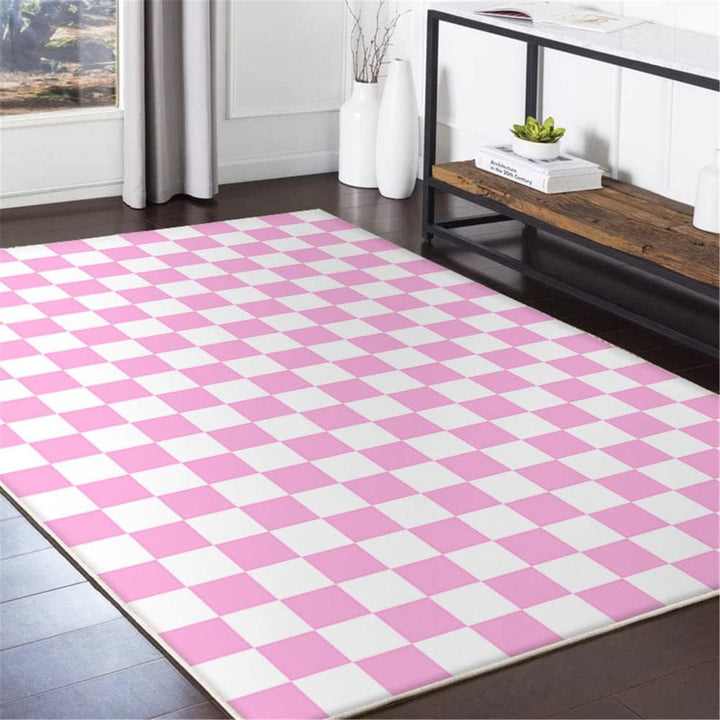 VibeCore Checkerboard Area Rug in Pink on the floor, featuring a bold pink and white checkerboard pattern that adds a modern, stylish touch to the space.