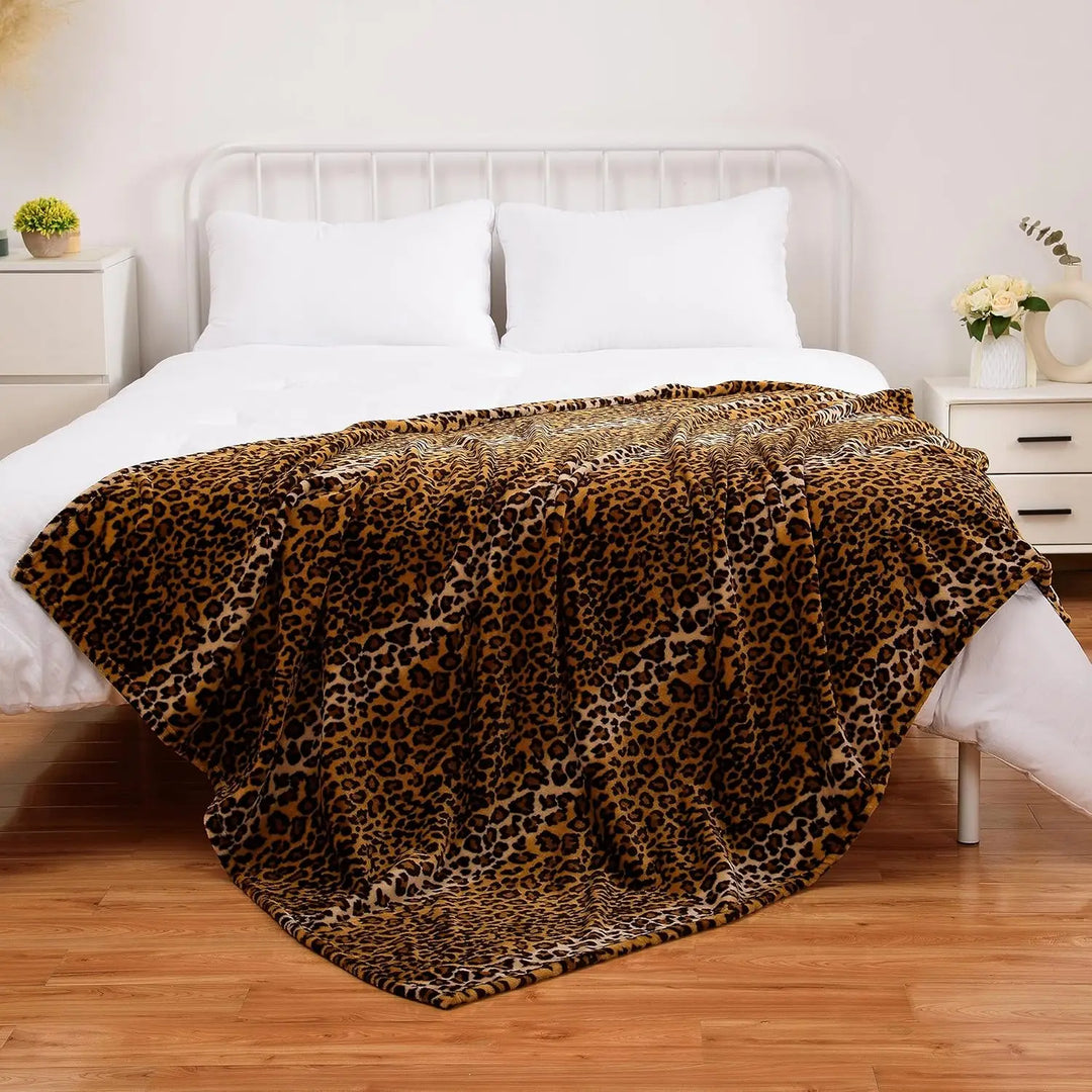 VibeCore Cheetah Print Fleece Throw Blanket Across Bed