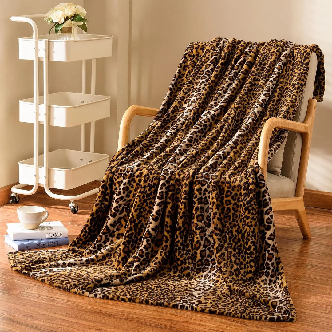 VibeCore Cheetah Print Fleece Throw Blanket Across Chair