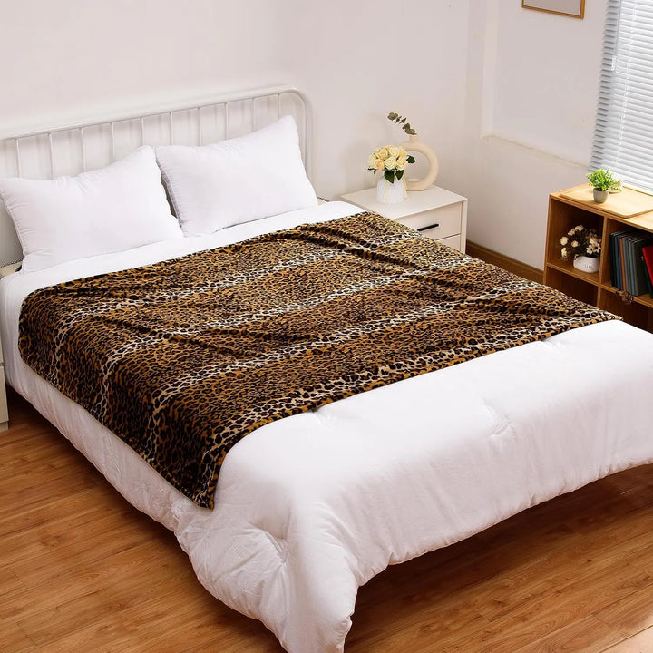 VibeCore Cheetah Print Fleece Throw Blanket On Bed