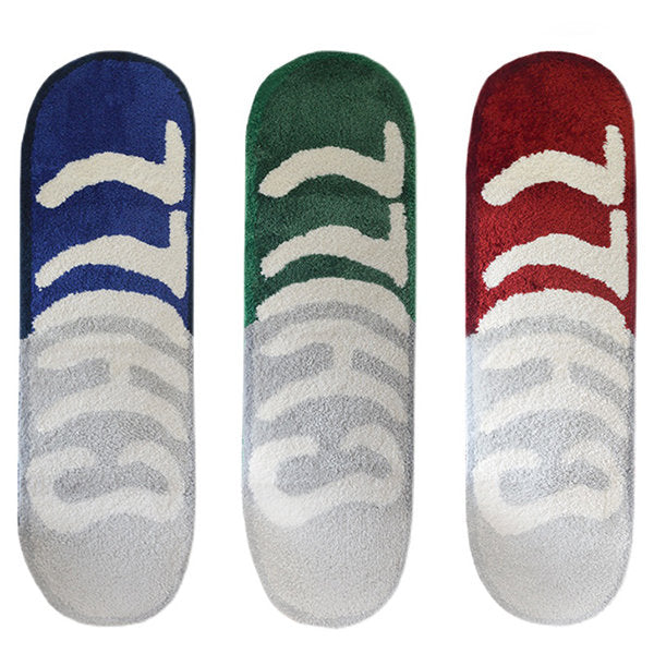 VibeCore Chill Pill Accent Rug in red, blue, and green, displayed together to showcase the vibrant colors and sleek, modern pill shape.