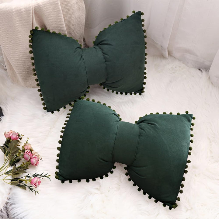 VibeCore Classic Bow Throw Pillows in dark green, two pillows featuring playful bow shapes with pom-poms around the edges, adding a stylish and fun touch to any room.