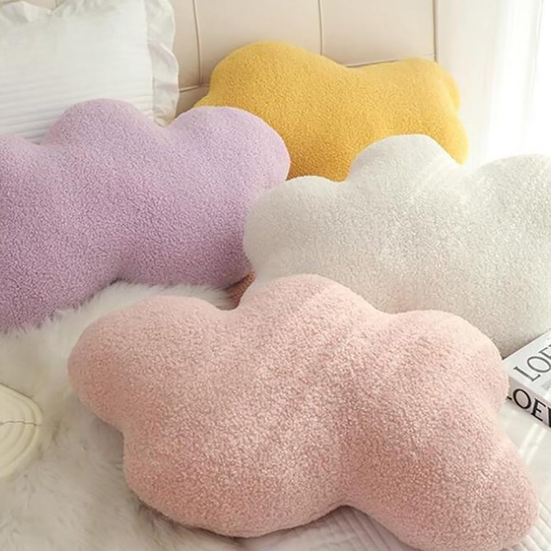 VibeCore Cloud Throw Pillows in white, pink, yellow, and purple, arranged on a bed, showcasing their fluffy, cloud-shaped design. Crafted from soft PP cotton, these cozy pillows bring a serene, calming vibe to your space, enhancing your decor with ultimate comfort and a dreamy feel.