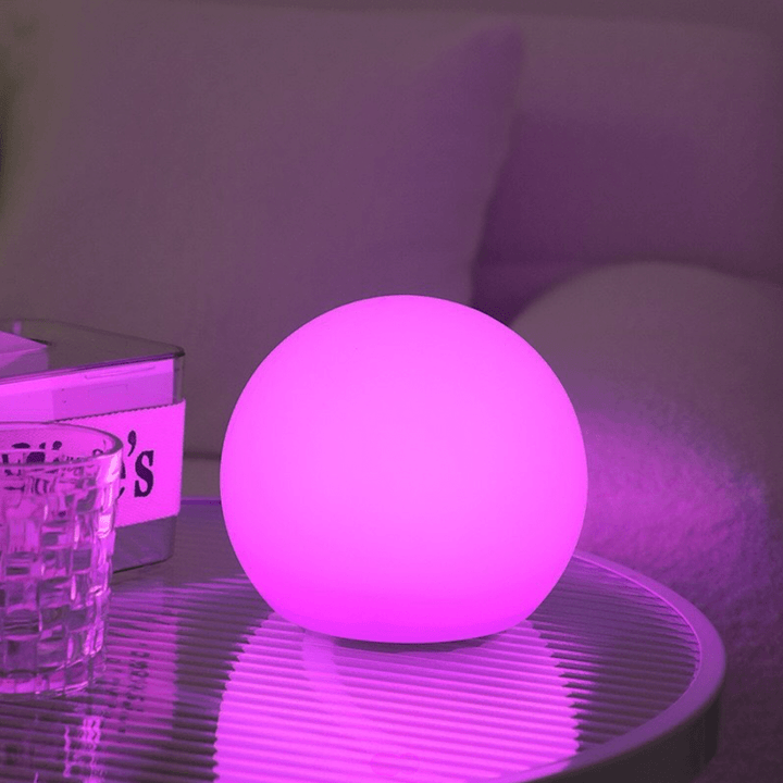 VibeCore Color-Changing LED Glow Ball in purple, displaying dynamic lighting effects and vibrant hues, ideal for enhancing mood lighting and decor.