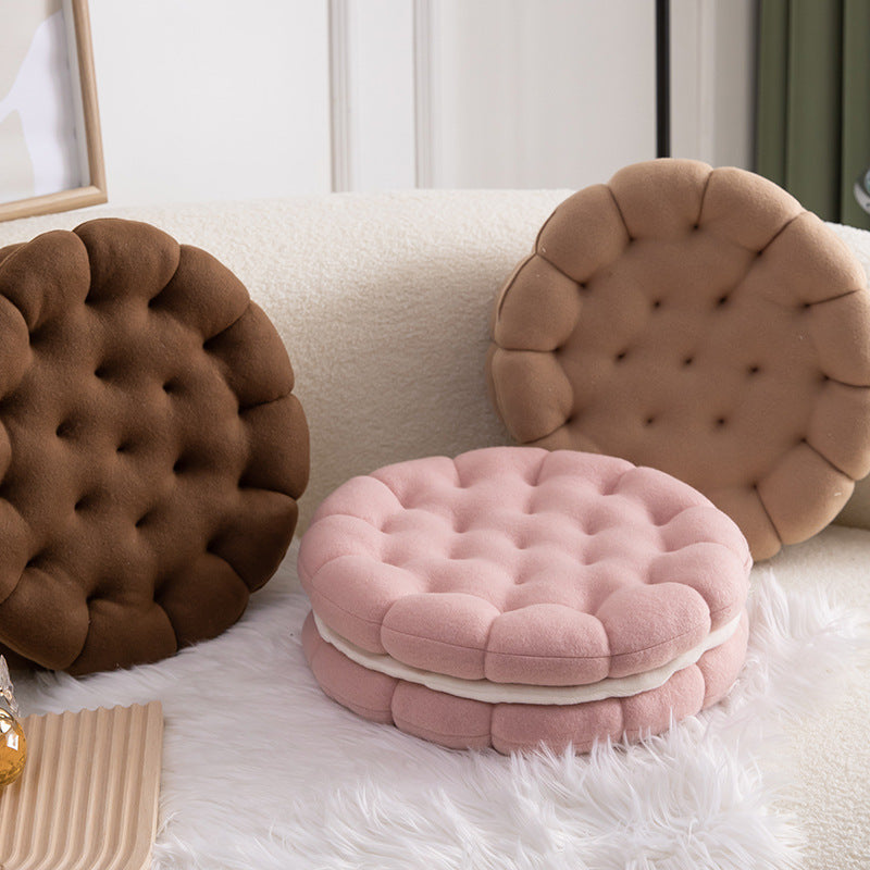 VibeCore Cookie Sandwich Throw Pillow in three colors (white, brown, and beige) on a cozy couch, adding a playful and whimsical touch to the living room decor. Soft and plush, perfect for brightening up any space with its unique cookie-shaped design.