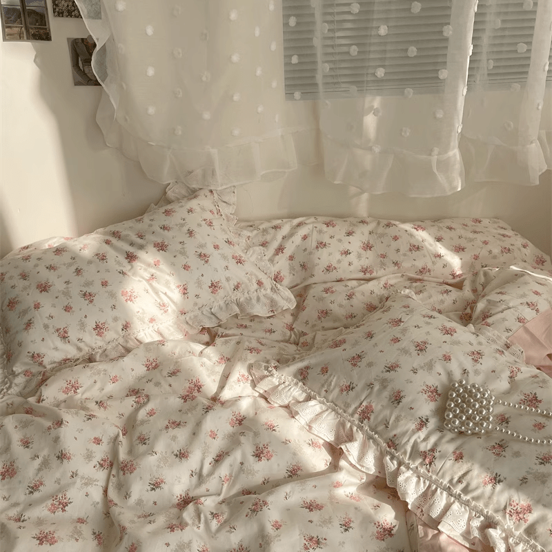 VibeCore Coquette Embroidered Pink Floral Duvet Cover Set aerial front view close-up, showcasing delicate floral embroidery and soft cotton texture in intricate detail.