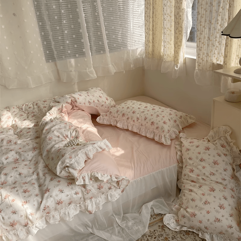 VibeCore Coquette Embroidered Pink Floral Duvet Cover Set full view, featuring soft pink floral embroidery, disheveled sheets, and pillows for a cozy, lived-in look.