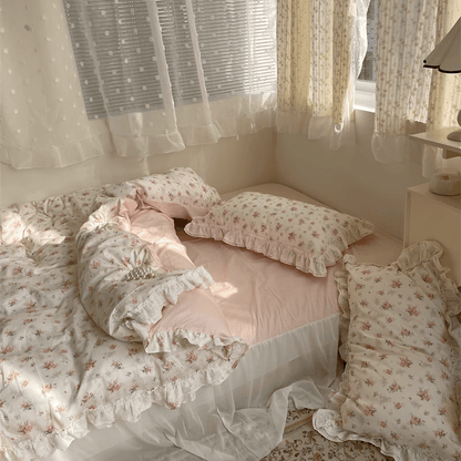 VibeCore Coquette Embroidered Pink Floral Duvet Cover Set full view, featuring soft pink floral embroidery, disheveled sheets, and pillows for a cozy, lived-in look.