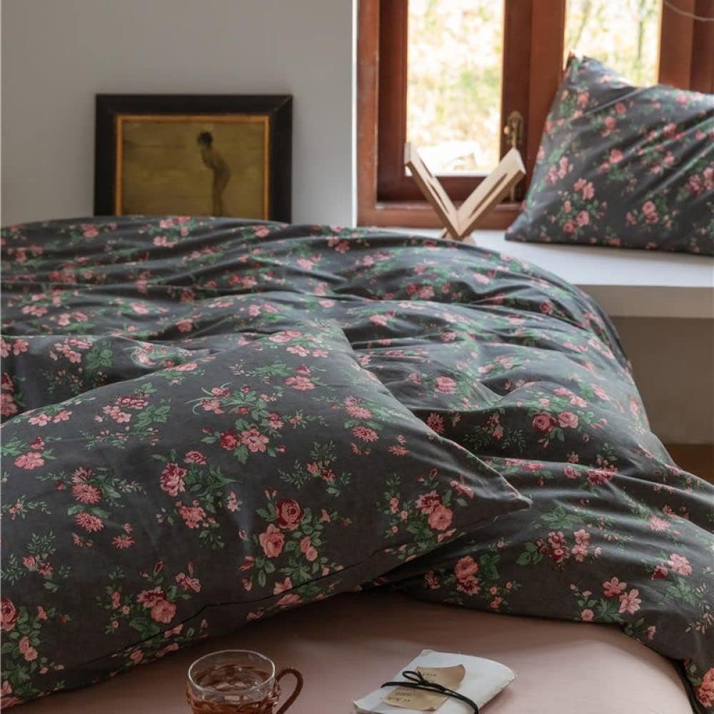 Close-up of the VibeCore Cottagecore Black Floral Duvet Cover Set Pillowcase, featuring a delicate black floral design on soft, breathable fabric for a cozy, vintage-inspired touch in your bedroom or dorm.