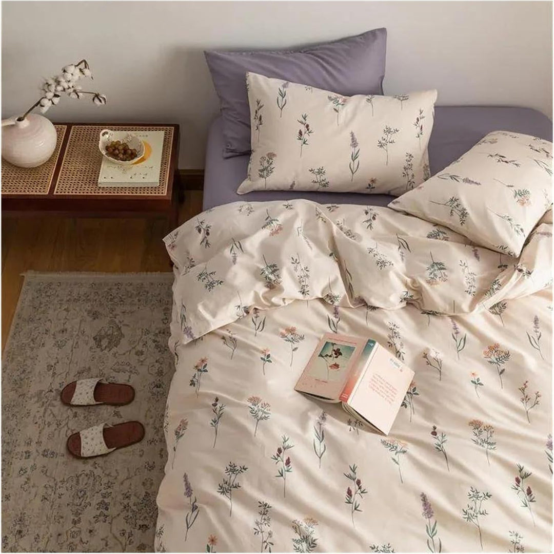 Aerial close-up of the VibeCore Cottagecore Gentle Blossom Duvet Cover Set, featuring delicate floral details and soft, beige tones. The duvet set offers a serene, nature-inspired aesthetic, perfect for creating a calming, cozy atmosphere in your bedroom or dorm.