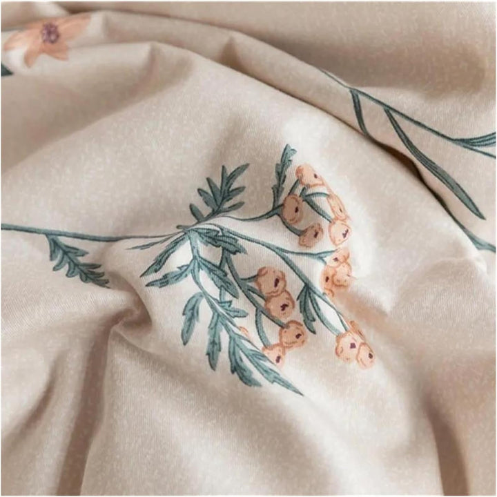 Close-up view of the VibeCore Cottagecore Gentle Blossom Duvet Cover Set, highlighting the intricate floral pattern on soft, breathable cotton fabric, perfect for adding a serene, nature-inspired aesthetic to your bedroom or dorm decor.