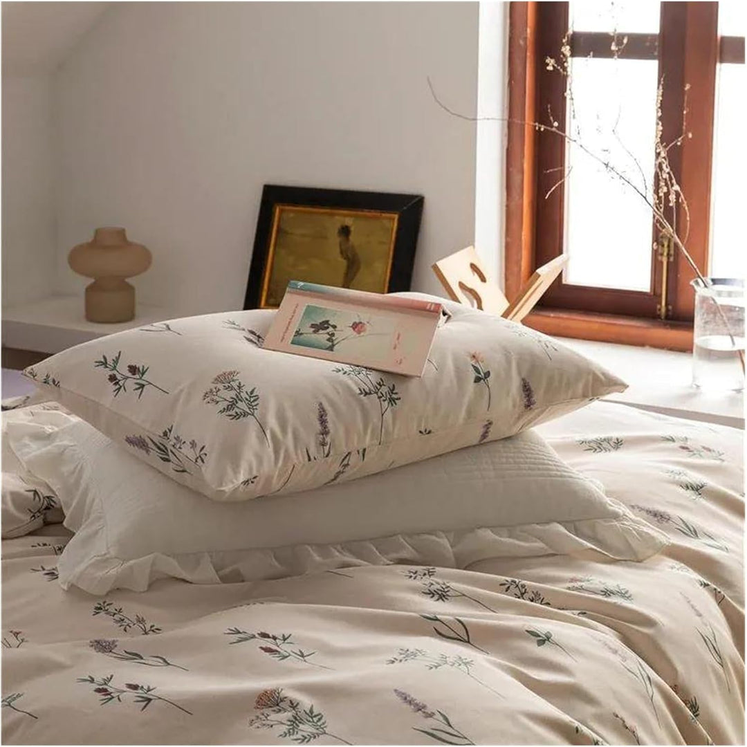 Close-up of the VibeCore Cottagecore Gentle Blossom Duvet Cover Set pillowcase, showcasing the delicate floral pattern on soft, breathable cotton fabric, adding a touch of natural beauty to your cozy bedroom or dorm setup.