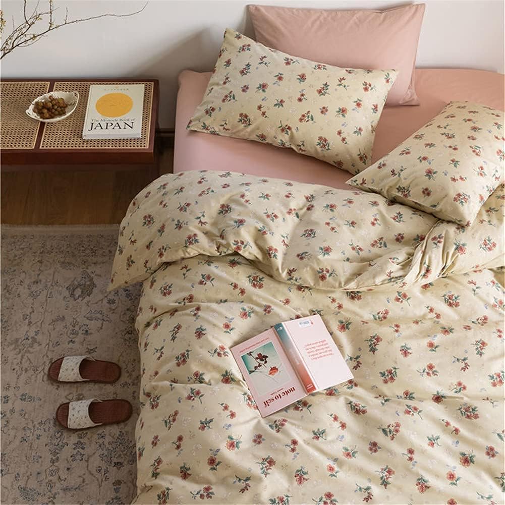 Aerial close-up of the VibeCore Cottagecore Vintage Floral Duvet Cover Set, featuring delicate vintage floral patterns on soft, cozy beige fabric, bringing timeless, vintage charm to your bedroom or dorm decor.
