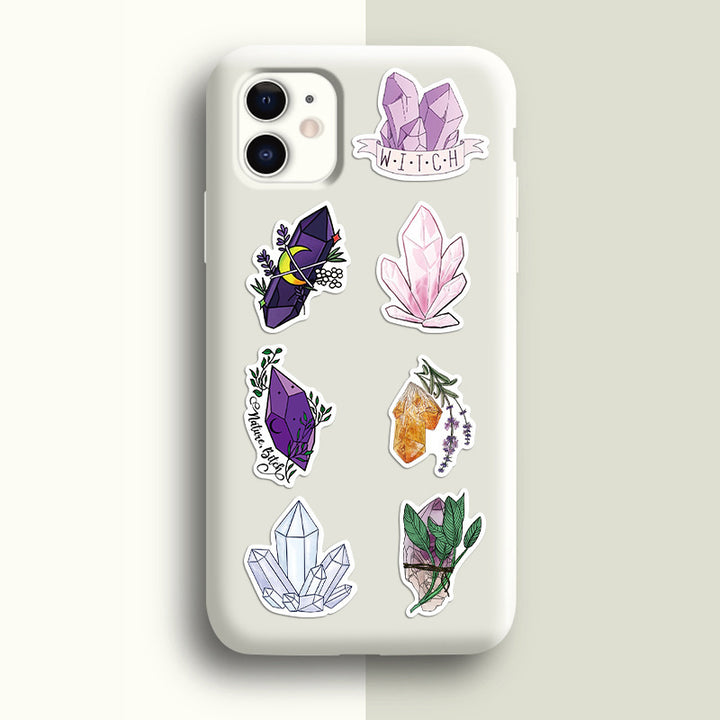 VibeCore Crystals Stickers applied to the back of a phone, showcasing crystal-inspired designs with gemstones and geometric patterns, adding a mystical touch to your device.