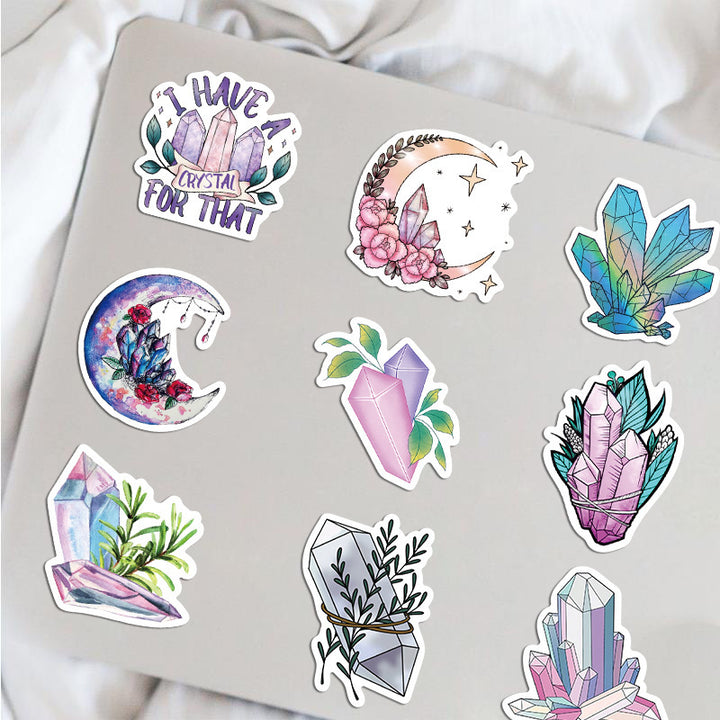 VibeCore Crystals Stickers applied to a notebook, featuring crystal-inspired designs like gemstones and geometric patterns, perfect for adding a mystical flair to your stationery.