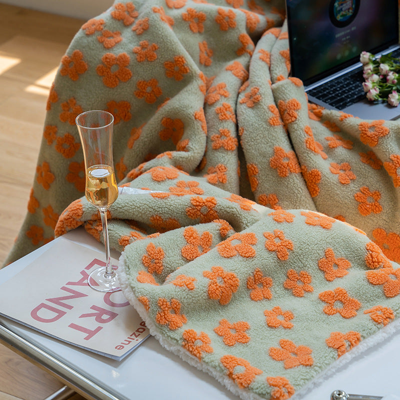 Orange Delicate Florals Fleece Throw Blanket, featuring a bold 70s-inspired floral design in vibrant hues. Ultra-soft coral fleece for cozy warmth and stylish comfort, perfect for adding a retro touch to any room.