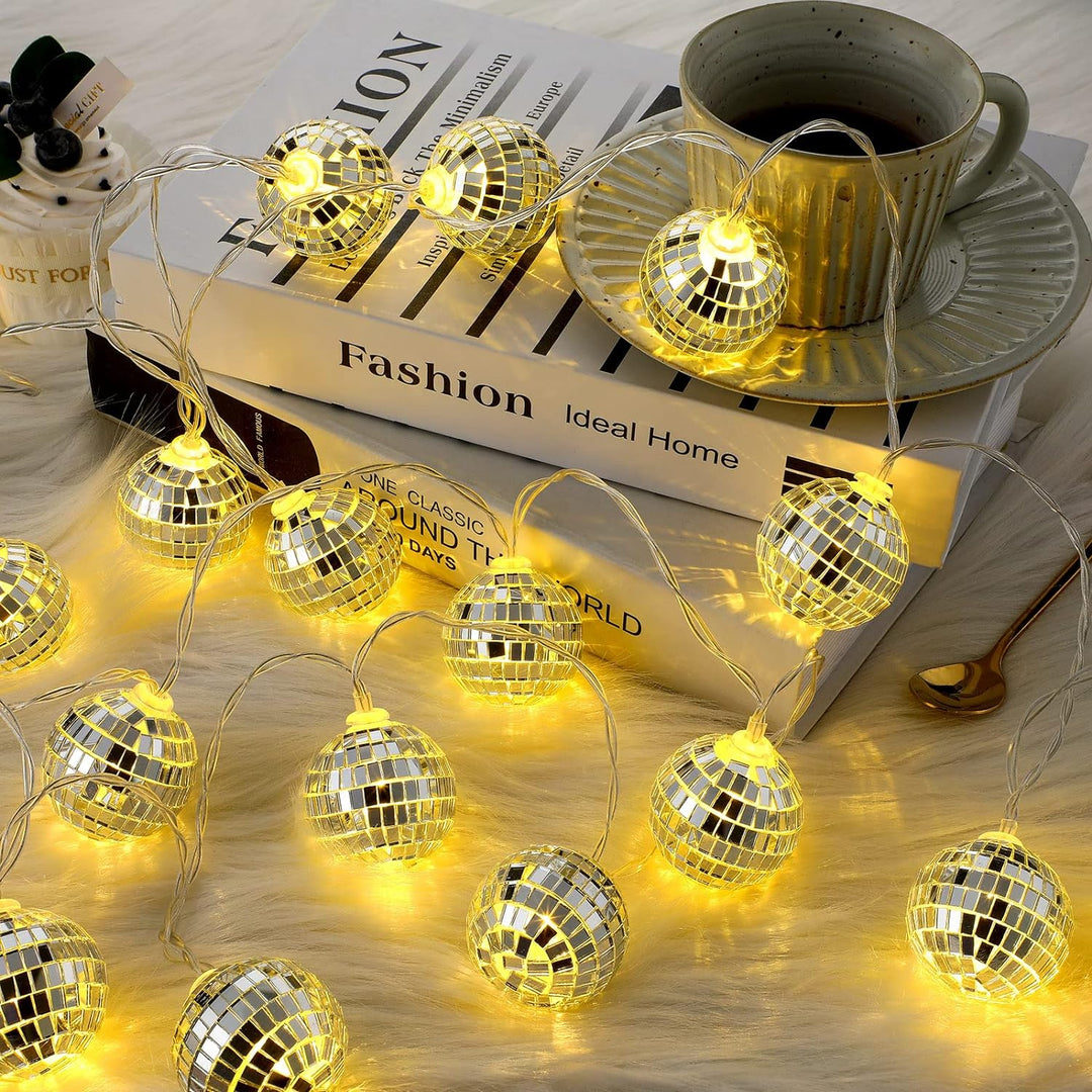 VibeCore Disco Ball String Lights displaying tiny, reflective disco balls, glowing with a warm white light, perfect for vibrant, eclectic decor.