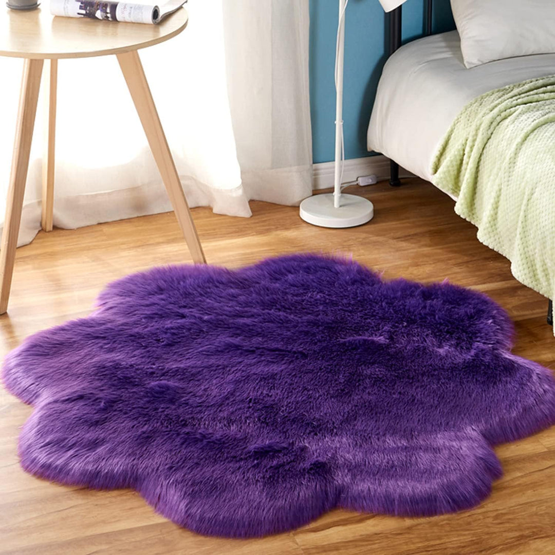 VibeCore Floral Faux Fur Accent Rug in Violet, shaped like a flower, adding a vibrant and playful touch to the room with its plush texture and cozy aesthetic.