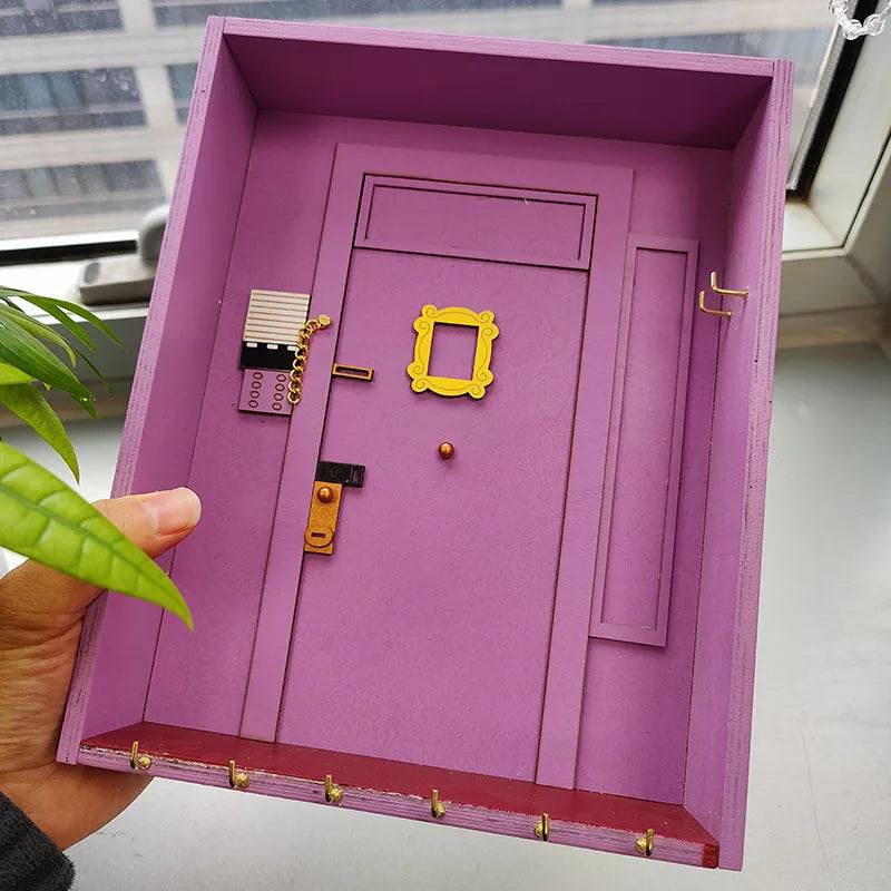 VibeCore Friends Wall Keychain Holder Being Held