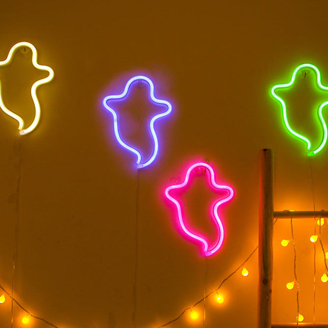 VibeCore Ghost Neon Light in all 4 colors (warm white, pink, purple, and green) on a wall, creating a playful and vibrant atmosphere.