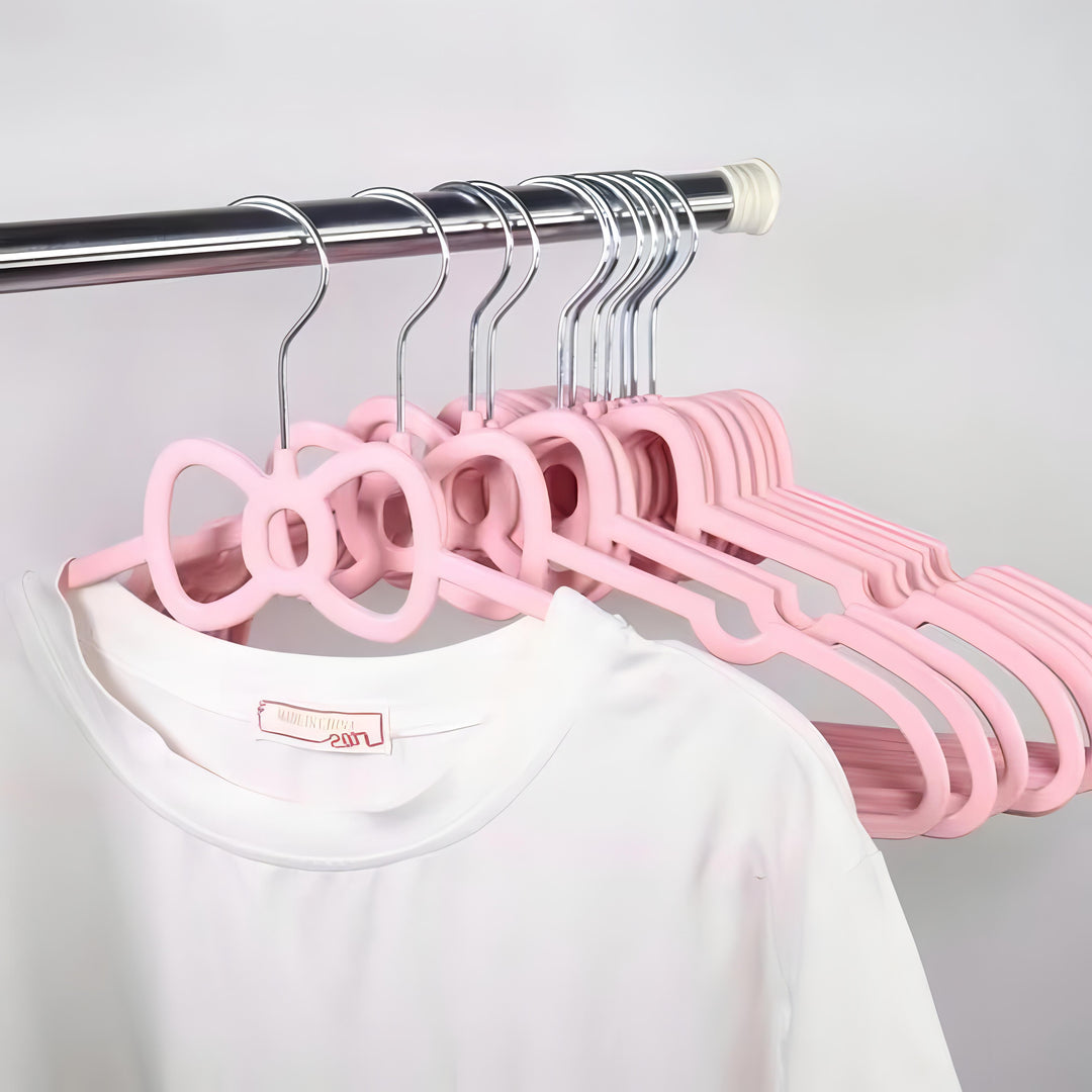 VibeCore Girly Coquette Hanger Bow On Clothes Rack With T-shirt On It
