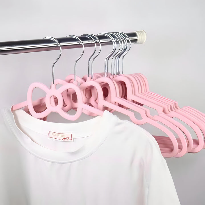 VibeCore Girly Coquette Hanger Bow On Clothes Rack With T-shirt On It