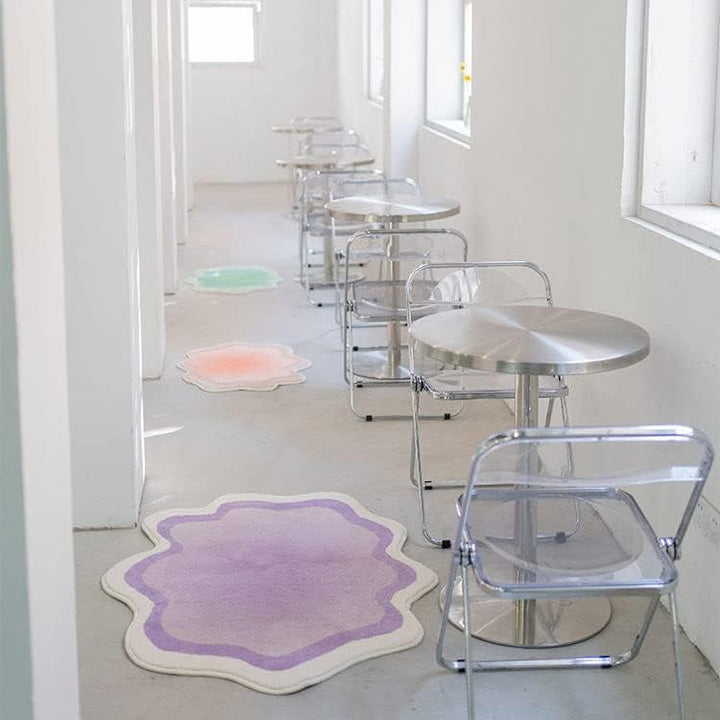The VibeCore Gradient Wave Accent Rug in all three colors—purple, pink, and green—displayed side by side, showcasing their fluid gradient designs and plush textures.