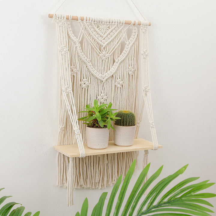VibeCore Handmade Macrame Hanging Shelf On Wall With Plants On It