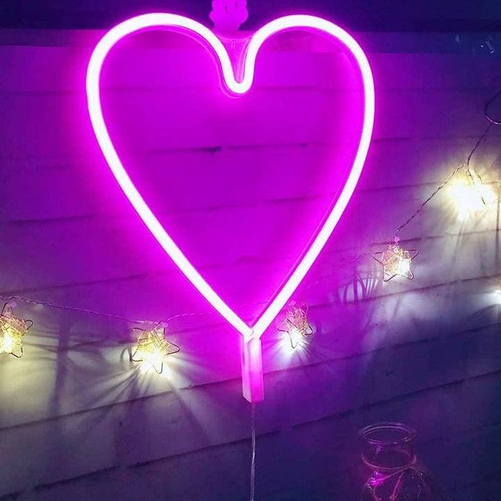 VibeCore Heart Neon Light Pink Against Fence