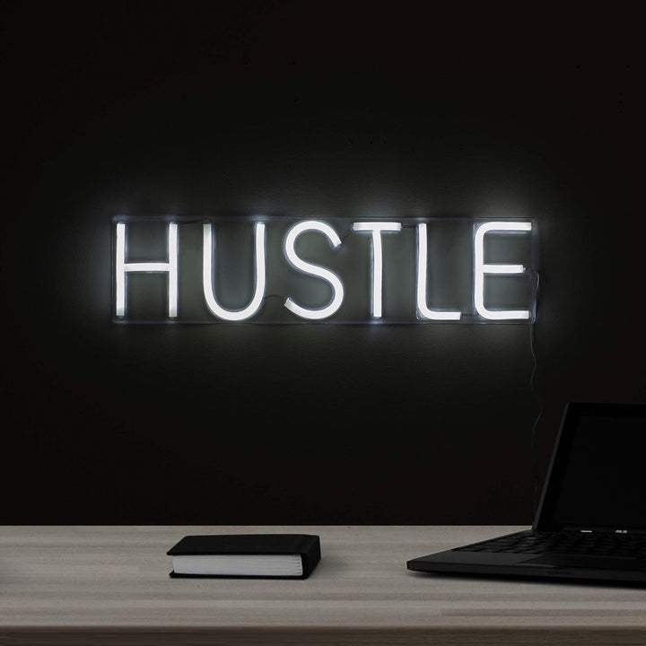 VibeCore Hustle Neon Sign On Office Wall